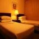 غرفة بسريرين  فندق منصوري مانشيانز - المنامة | هوتيلز عربي